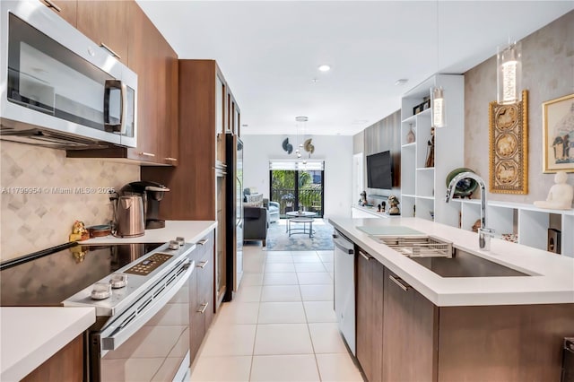 8301 NW 41st St Unit B-305, Doral, FL 33166 - kitchen featuring stainless steel appliances, a sink, and light countertops