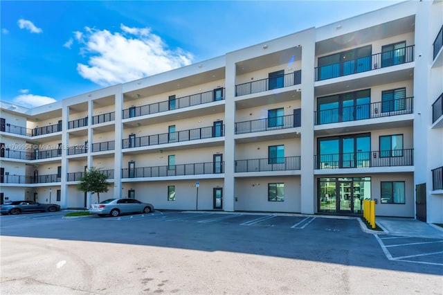 8301 NW 41st St Unit B-305, Doral, FL 33166 - view of apartment building / complex featuring uncovered parking