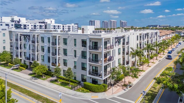 8301 NW 41st St Unit B-305, Doral, FL 33166 - view of apartment building / complex featuring a city view