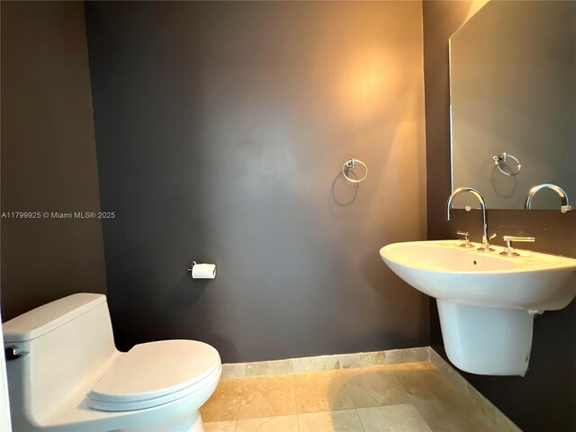 6515 Collins Ave Unit 1801, Miami Beach, FL 33141 - half bath with toilet and baseboards