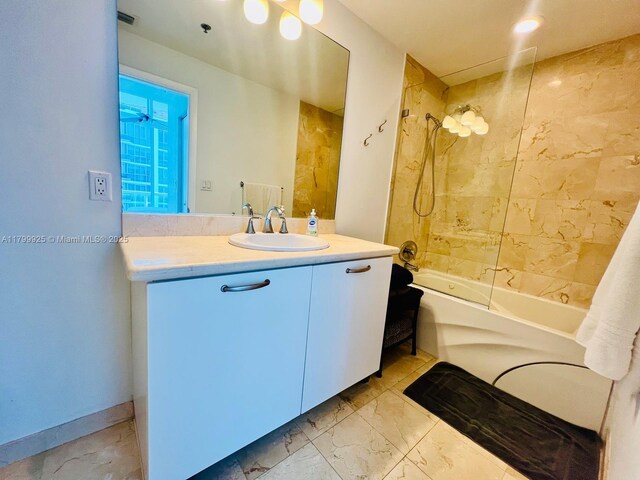 6515 Collins Ave Unit 1801, Miami Beach, FL 33141 - bathroom with marble look tiles, shower / washtub combination, and vanity