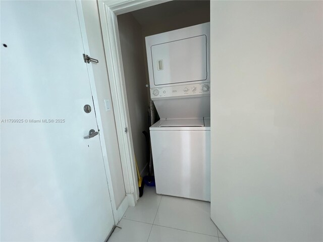 6515 Collins Ave Unit 1801, Miami Beach, FL 33141 - laundry area featuring estacked washer and dryer and light tile patterned floors