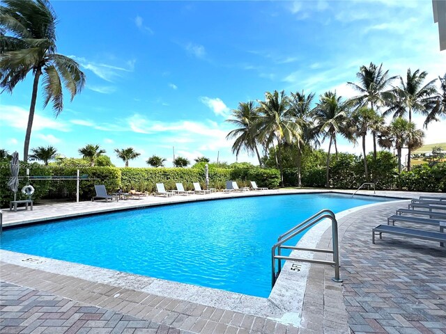 6515 Collins Ave Unit 1801, Miami Beach, FL 33141 - community pool featuring a patio area