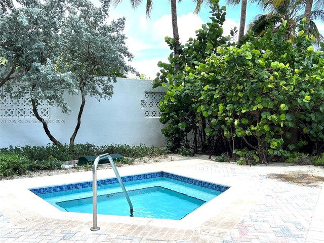 6515 Collins Ave Unit 1801, Miami Beach, FL 33141 - view of swimming pool featuring a swimming pool