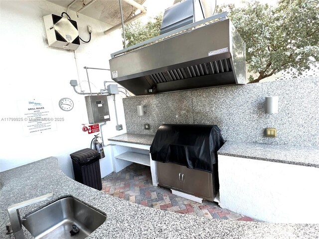 6515 Collins Ave Unit 1801, Miami Beach, FL 33141 - view of patio featuring exterior kitchen and a sink