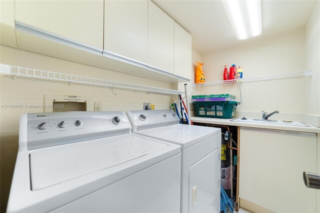 2450 Presidential Way Unit 1607, West Palm Beach, FL 33401 - washroom with cabinet space and separate washer and dryer