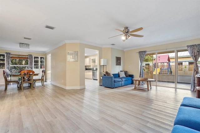 4161 W Silverado Cir, Davie, FL 33024 - living area featuring a ceiling fan, light wood finished floors, crown molding, and baseboards