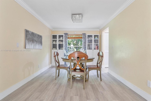 4161 W Silverado Cir, Davie, FL 33024 - dining space featuring light wood-style flooring, ornamental molding, and baseboards