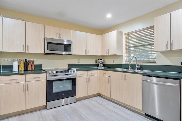 4161 W Silverado Cir, Davie, FL 33024 - kitchen with appliances with stainless steel finishes, light brown cabinets, a sink, dark countertops, and recessed lighting
