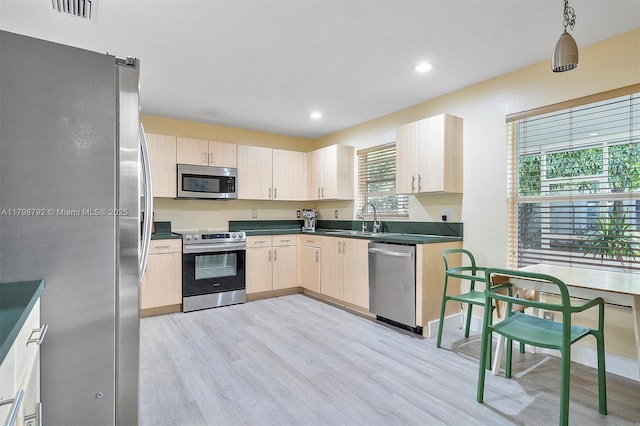 4161 W Silverado Cir, Davie, FL 33024 - kitchen featuring stainless steel appliances, light brown cabinets, a sink, light wood-style flooring, and recessed lighting