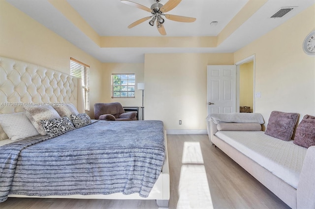 4161 W Silverado Cir, Davie, FL 33024 - bedroom with wood finished floors, a raised ceiling, baseboards, and ceiling fan