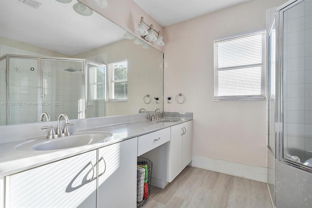 4161 W Silverado Cir, Davie, FL 33024 - full bath with tiled shower, wood finished floors, double vanity, and baseboards