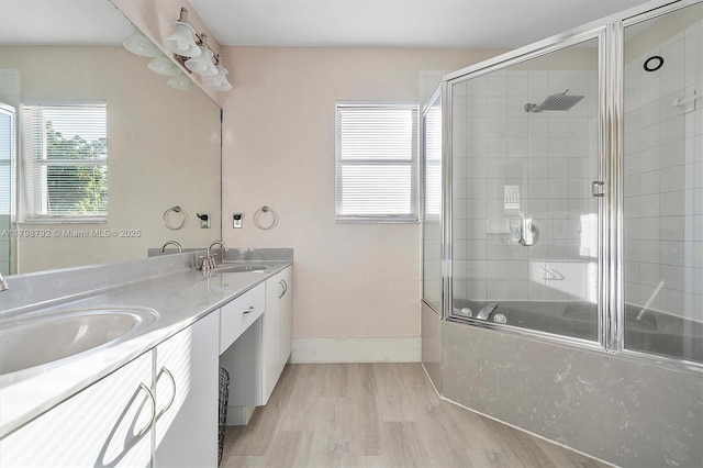 4161 W Silverado Cir, Davie, FL 33024 - bathroom with wood finished floors, enclosed tub / shower combo, baseboards, and double vanity