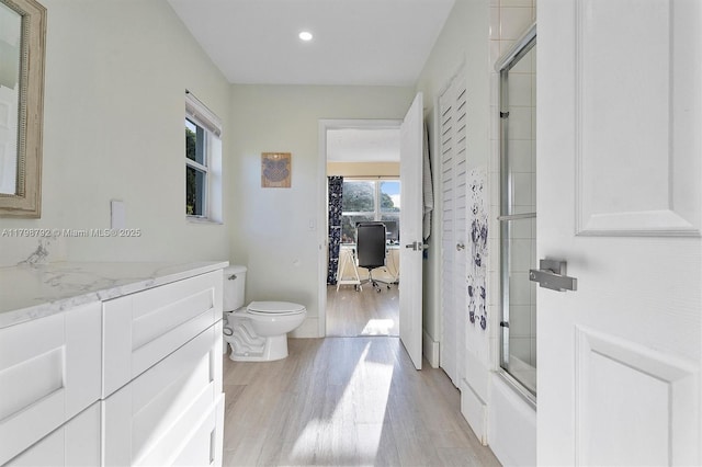 4161 W Silverado Cir, Davie, FL 33024 - bathroom featuring wood finished floors, an enclosed shower, recessed lighting, vanity, and toilet