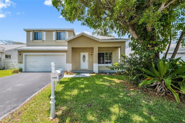 14480 SW 145th Pl, Miami, FL 33186 - traditional home featuring stucco siding, driveway, a garage, and a front yard