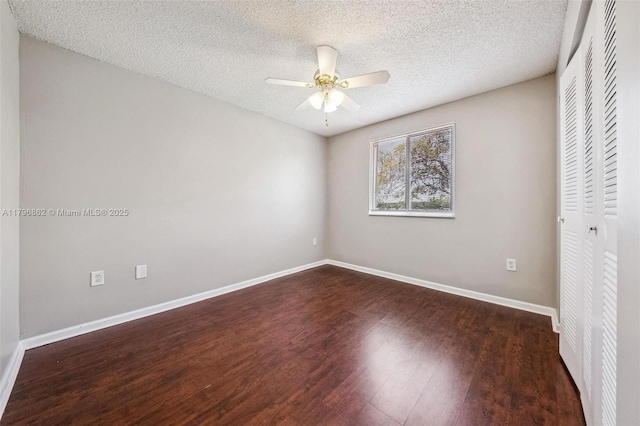 14480 SW 145th Pl, Miami, FL 33186 - empty room with dark wood-style flooring, ceiling fan, a textured ceiling, and baseboards