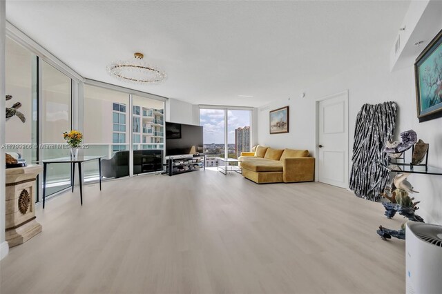 200 Sunny Isles Blvd Unit 2-1503, Sunny Isles Beach, FL 33160 - living area featuring wood finished floors and expansive windows