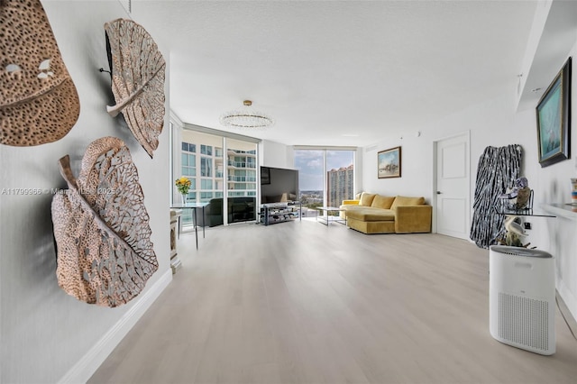 200 Sunny Isles Blvd Unit 2-1503, Sunny Isles Beach, FL 33160 - living room featuring wood finished floors, expansive windows, and baseboards