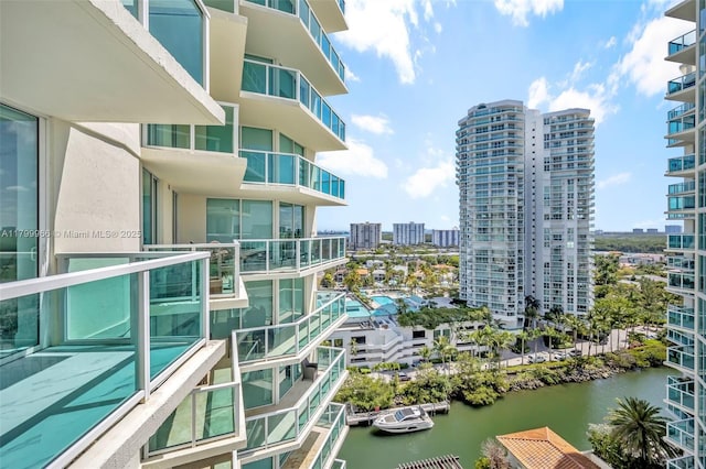 balcony with a water view and a city view