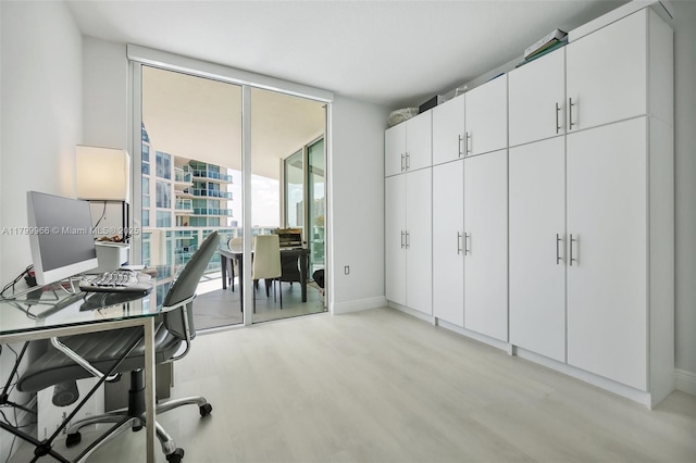 200 Sunny Isles Blvd Unit 2-1503, Sunny Isles Beach, FL 33160 - office featuring light wood-style flooring, a wall of windows, and baseboards