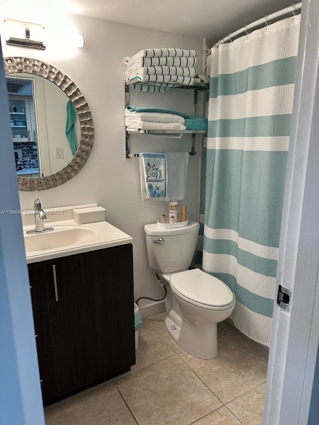 19201 Collins Ave Unit 712, Sunny Isles Beach, FL 33160 - full bathroom featuring tile patterned floors, toilet, vanity, and curtained shower