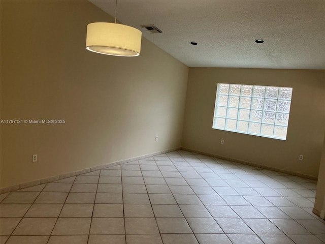 17691 SW 4th Ct, Pembroke Pines, FL 33029 - spare room with a textured ceiling, light tile patterned flooring, and baseboards