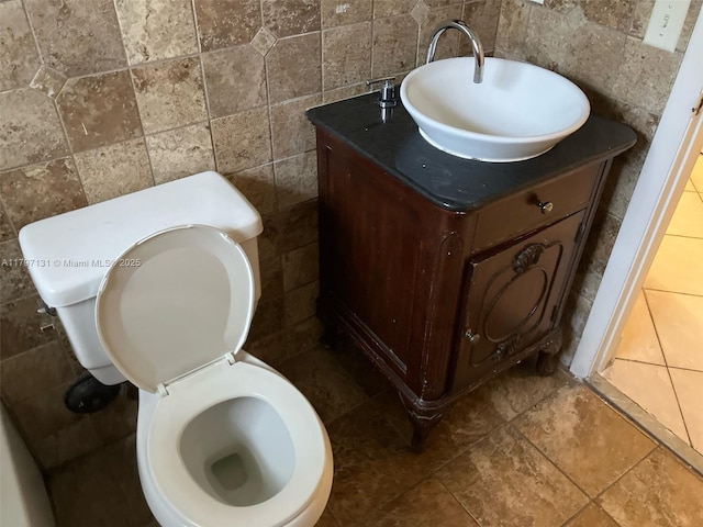 17691 SW 4th Ct, Pembroke Pines, FL 33029 - bathroom with toilet, vanity, and tile walls