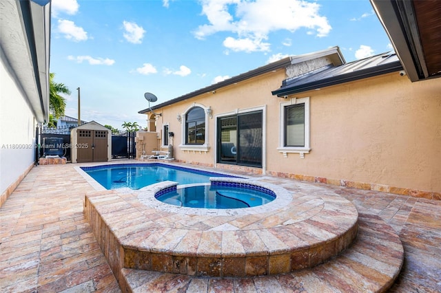 13111 NW 11th Ter, Miami, FL 33182 - view of swimming pool featuring a shed, an outbuilding, a pool with connected hot tub, and a patio area