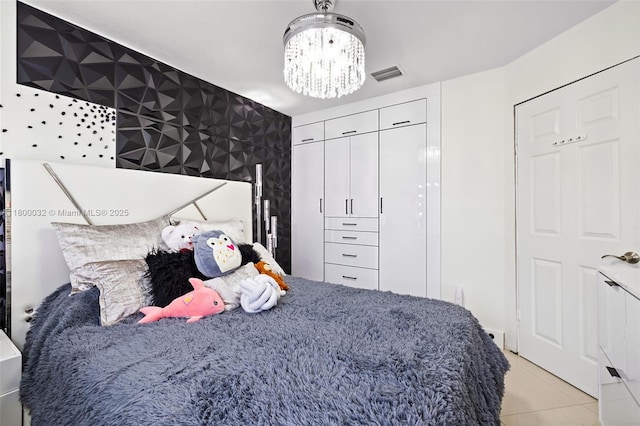 13111 NW 11th Ter, Miami, FL 33182 - bedroom featuring light tile patterned floors, a chandelier, and a closet