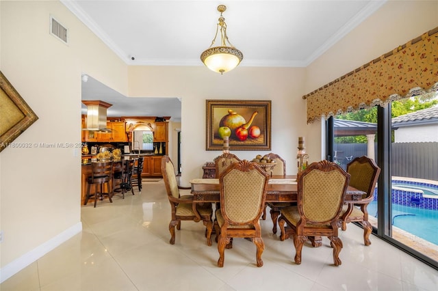 13111 NW 11th Ter, Miami, FL 33182 - dining room featuring crown molding, light tile patterned flooring, and baseboards