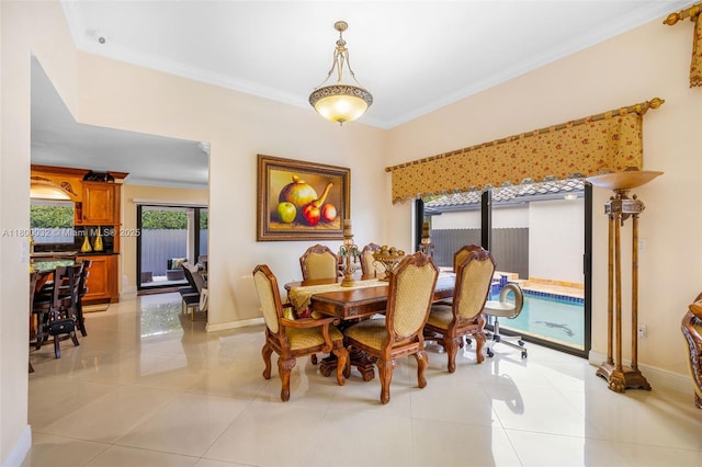 13111 NW 11th Ter, Miami, FL 33182 - dining area featuring baseboards, crown molding, and light tile patterned floors