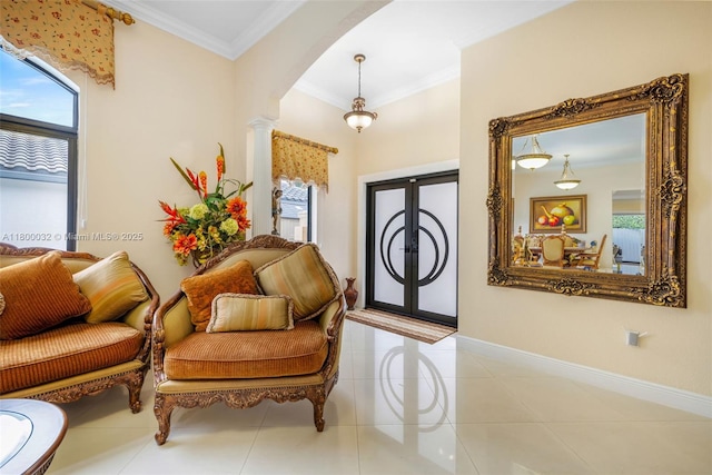 13111 NW 11th Ter, Miami, FL 33182 - foyer featuring tile patterned floors, french doors, arched walkways, decorative columns, and ornamental molding