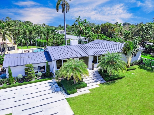 515 NE 115th St, Biscayne Park, FL 33161 - view of property with fence and view of scattered trees