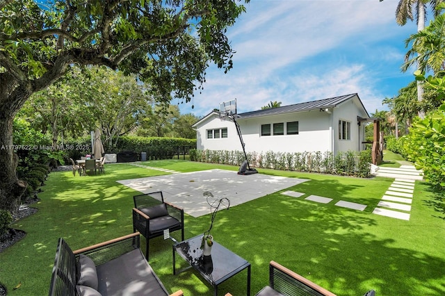 515 NE 115th St, Biscayne Park, FL 33161 - rear view of property featuring a standing seam roof, stucco siding, a patio area, and metal roof