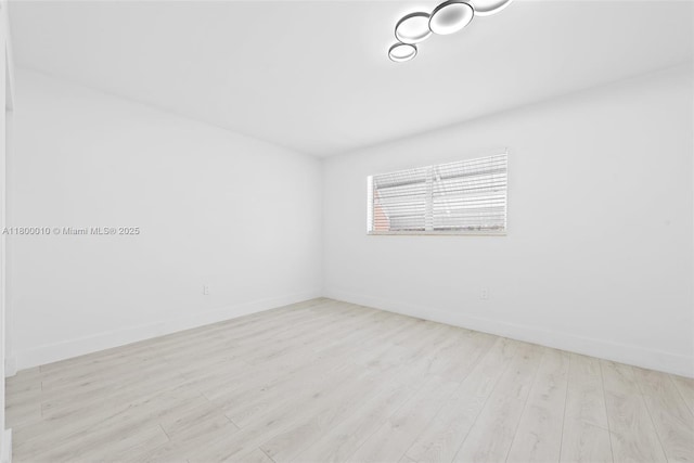 450 SE 7th St Unit 214, Dania Beach, FL 33004 - empty room with wood finished floors and baseboards