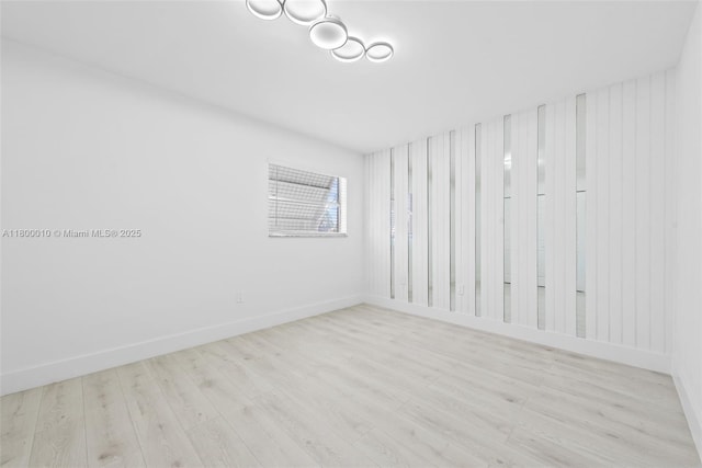 450 SE 7th St Unit 214, Dania Beach, FL 33004 - spare room with wood finished floors and baseboards