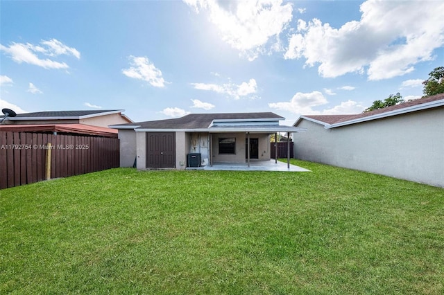 19231 SW 121st Ave, Miami, FL 33177 - rear view of house featuring central air condition unit, a patio area, and stucco siding