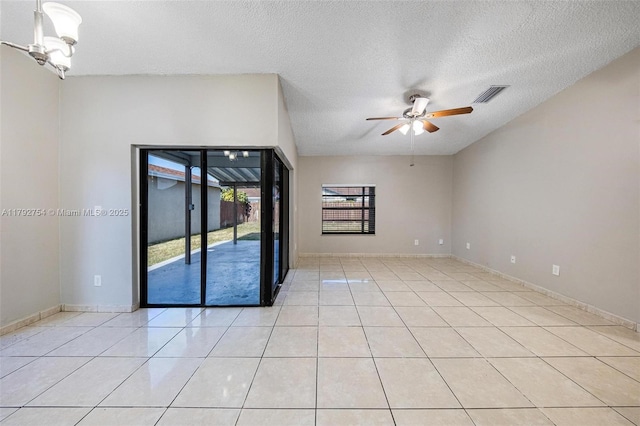 19231 SW 121st Ave, Miami, FL 33177 - empty room featuring a ceiling fan, light tile patterned floors, a textured ceiling, and baseboards