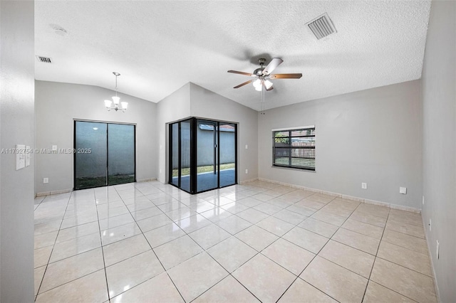 19231 SW 121st Ave, Miami, FL 33177 - spare room with light tile patterned flooring, a chandelier, a ceiling fan, a textured ceiling, and vaulted ceiling