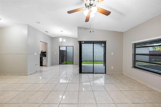 19231 SW 121st Ave, Miami, FL 33177 - unfurnished room with vaulted ceiling, healthy amount of natural light, light tile patterned flooring, a ceiling fan, and a textured ceiling