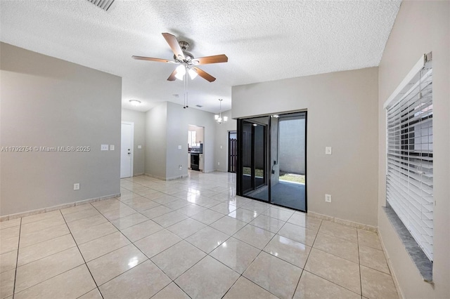 19231 SW 121st Ave, Miami, FL 33177 - spare room featuring a ceiling fan, light tile patterned floors, a textured ceiling, and baseboards