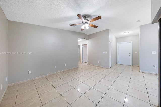 19231 SW 121st Ave, Miami, FL 33177 - spare room with a ceiling fan, a textured ceiling, light tile patterned flooring, and baseboards