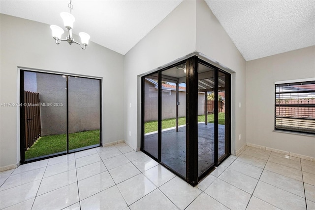 19231 SW 121st Ave, Miami, FL 33177 - interior space with lofted ceiling, a chandelier, and baseboards
