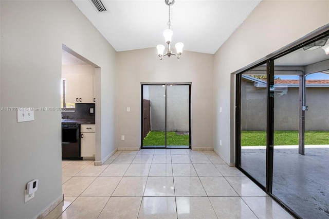 19231 SW 121st Ave, Miami, FL 33177 - doorway to outside with vaulted ceiling, a chandelier, healthy amount of natural light, light tile patterned flooring, and baseboards