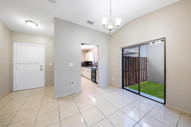 19231 SW 121st Ave, Miami, FL 33177 - empty room with a chandelier, light tile patterned floors, baseboards, and a sink
