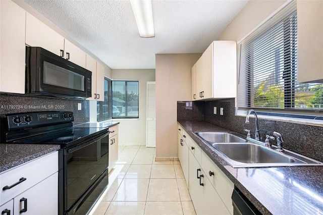19231 SW 121st Ave, Miami, FL 33177 - kitchen featuring black appliances, a sink, tasteful backsplash, dark countertops, and white cabinetry