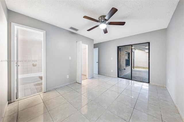 19231 SW 121st Ave, Miami, FL 33177 - unfurnished bedroom featuring a textured ceiling, light tile patterned flooring, baseboards, a ceiling fan, and access to exterior
