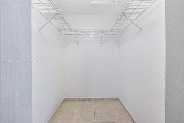 19231 SW 121st Ave, Miami, FL 33177 - walk in closet with light tile patterned flooring