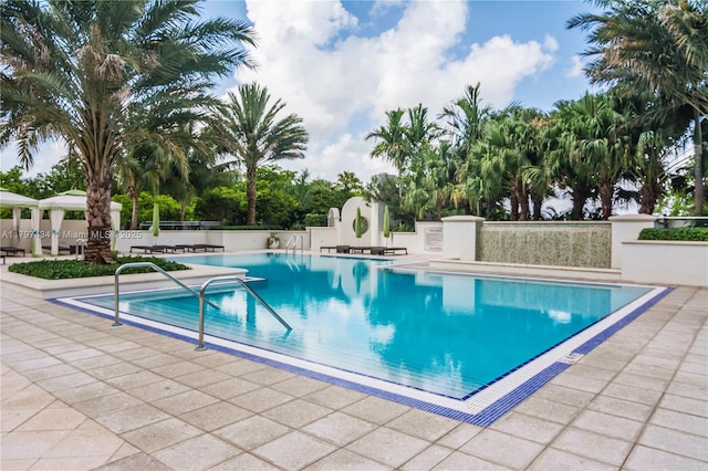 community pool featuring a patio area