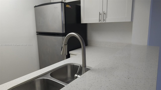 1720 NW N River Dr Unit 113, Miami, FL 33125 - kitchen view of white cabinets and light stone countertops